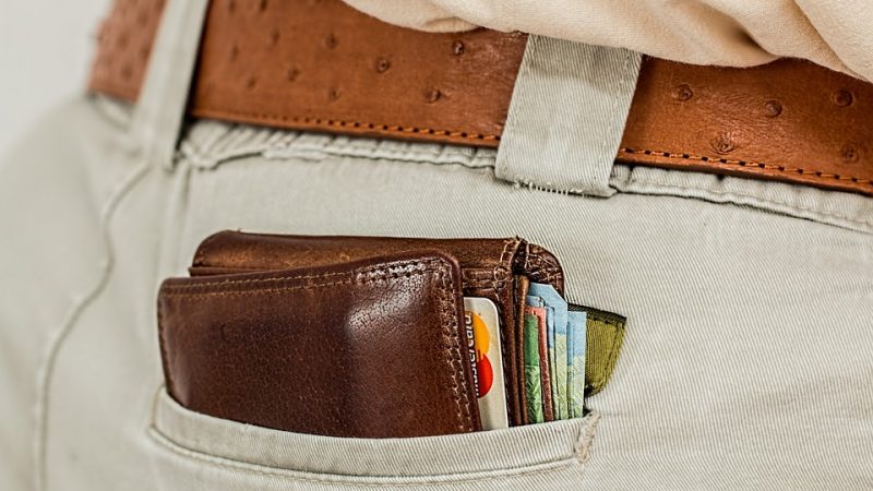 Large wallet sticking out of back pocket